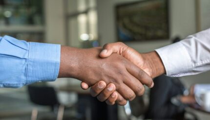 two people shaking hands
